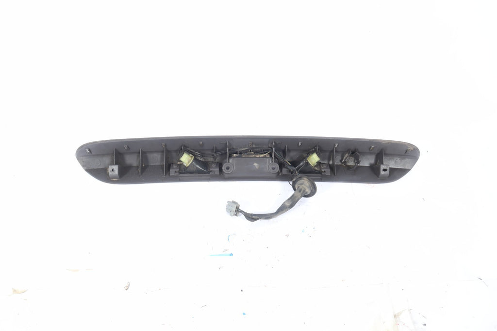2001-2005 DODGE GRAND CARAVAN REAR LICENSE PLATE LIGHT FILLER MOULDING OEM