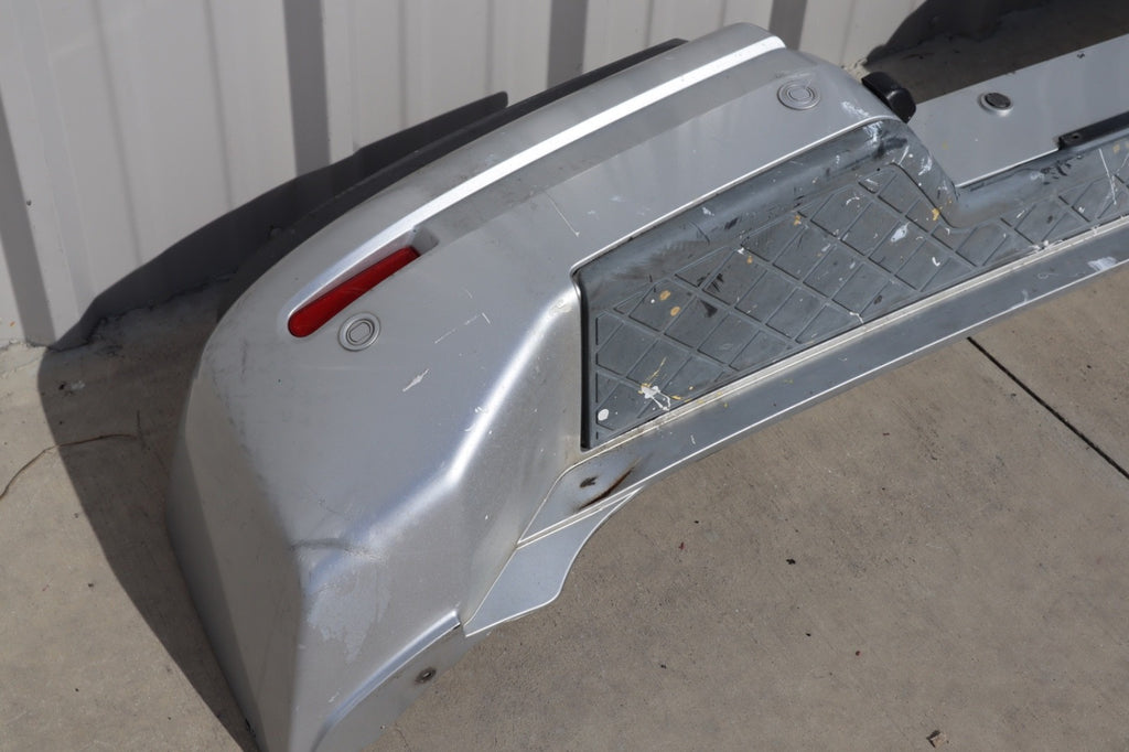 2007 Nissan Armada Rear Bumper Cover Plastic OEM