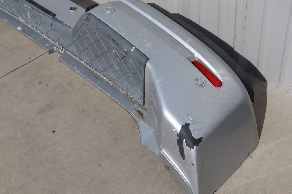 2007 Nissan Armada Rear Bumper Cover Plastic OEM